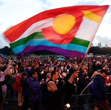 denver, co   june 13 mark wonder waves his rainbow color colorado flag as he and about 2,000 supporters attended the pflag denver chapter candle vigil june 13, 2016 at cheeseman park a silent candle vigil was held in support of the tragic event at pulse night club in orlando, florida  photo by john leybathe denver post via getty images